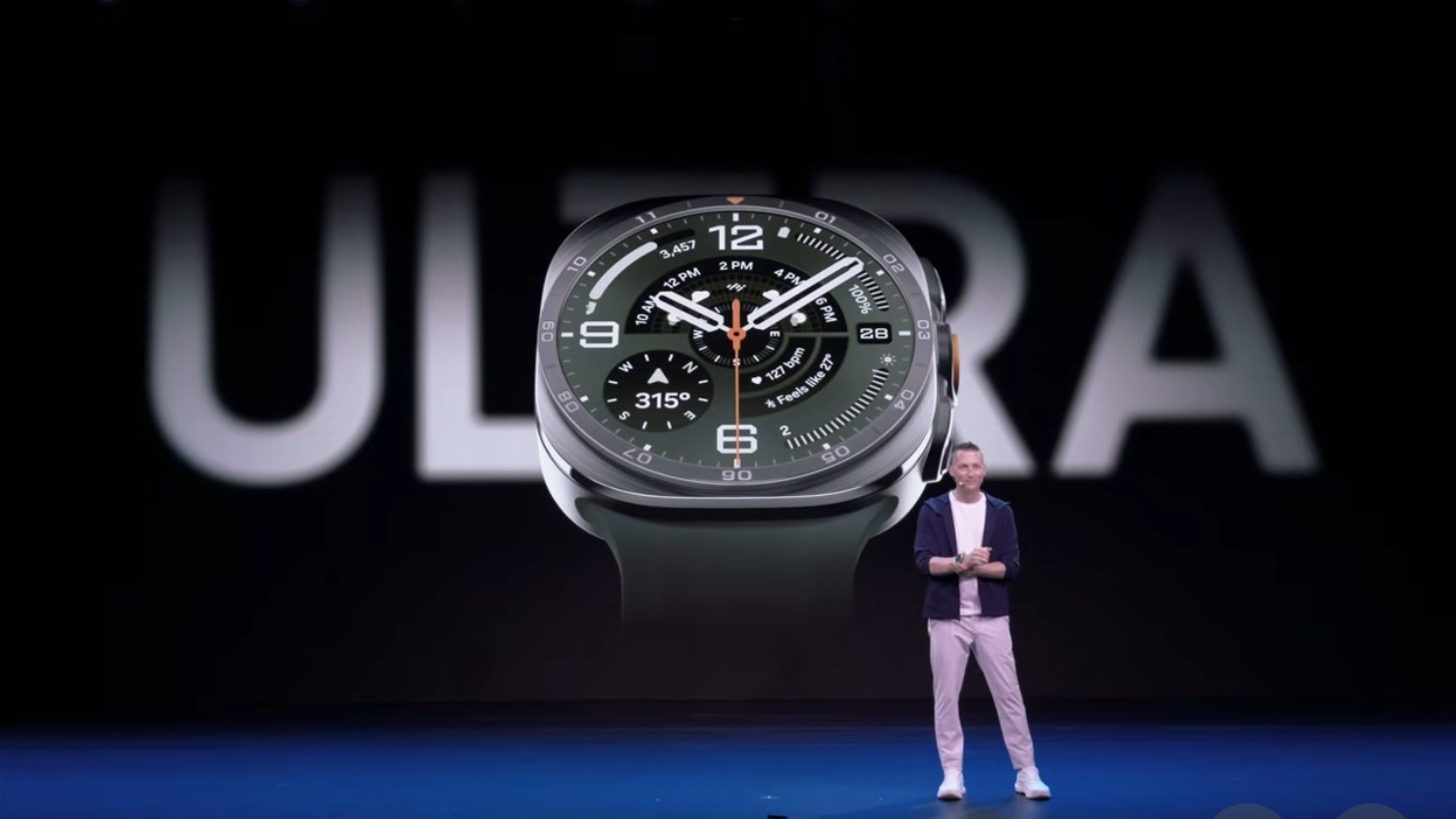 Samsung presenter beside an enlarged Galaxy Watch Ultra 2 on the Unpacked stage