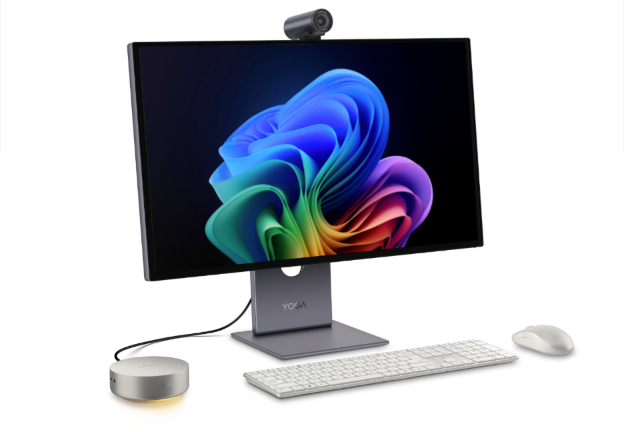 Lenovo Yoga AI Mini PC on a desk connected to a monitor, keyboard, and mouse