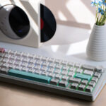 Epomaker TH65 65% mechanical keyboard in white on a desk